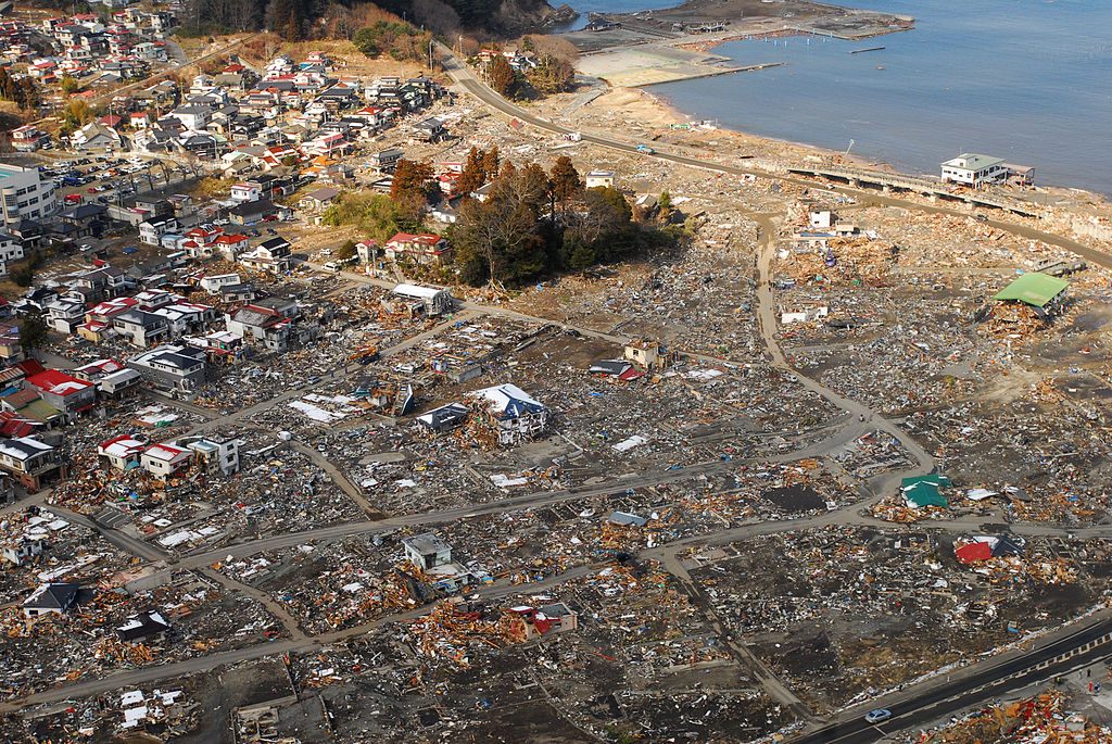 Aerial_view_of_damage_to_Kirikiri,_Otsuchi,_a_week_after_a_9.0_magnitude_earthquake_and_subsequent_tsunami